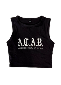 Black cropped tank top laid flat, printed with "A.C.A.B." in white gothic letters above "Assigned Cunty at Birth", a trans rights slogan