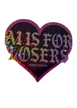 Black glitter heart sticker with sparkly gothic "AI Is for Losers" lettering and a pink glitter edge
