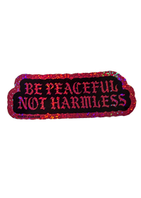 pink glitter be peaceful not harmless sticker