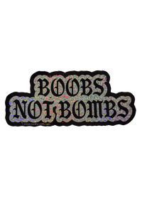 Silver glitter Boobs Not Bombs sticker with black gothic lettering