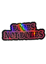 Pink holographic Boobs Not Bombs sticker with black gothic lettering