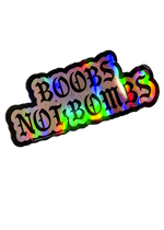 Silver holographic Boobs Not Bombs sticker with black gothic lettering