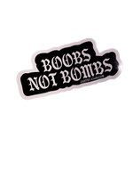 Black Boobs Not Bombs sticker with white gothic lettering and a white edge