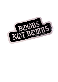 Black Boobs Not Bombs sticker with white gothic lettering and a white edge