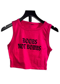 Boobs Not Bombs free Palestine tank on a hanger, hot pink cropped tank with black gothic print