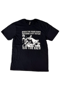 Black t-shirt laid flat with a black and white classical painting of women at a feast and gothic text reading "When the poor have nothing left to eat, eat the rich"