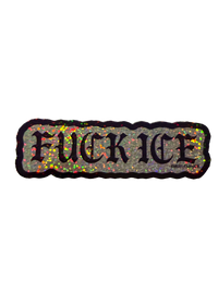 Silver glitter Fuck ICE sticker with black gothic lettering, angled to catch the sparkle