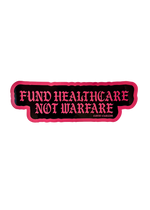 Black Fund Healthcare Not Warfare sticker with pink gothic lettering and a pink edge