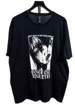 Black t-shirt on a hanger with a large black and white face graphic, "Don't want to see trans people?" above and "Gouge Out Your Eyes" below