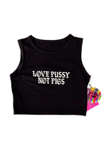Black cropped tank top laid flat with "Love Pussy Not Pigs" in white gothic letters and a pink hangtag