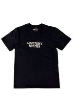 Black t-shirt laid flat with "Love Pussy Not Pigs" in small white gothic letters on the chest