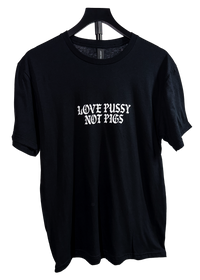 Love Pussy Not Pigs anti police t-shirt on a hanger, black with a white gothic chest print