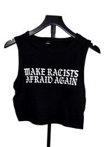 Black cropped tank top on a hanger with "Make Racists Afraid Again" printed across the chest in white gothic letters
