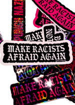 Black "Make Racists Afraid Again" sticker with white gothic lettering on a pile of Cuntry Club stickers