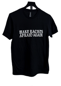 A black short-sleeve crewneck t-shirt hanging on a black hanger against a white background, featuring the text 'MAKE RACISTS AFRAID AGAIN' printed in a white gothic font across the chest.