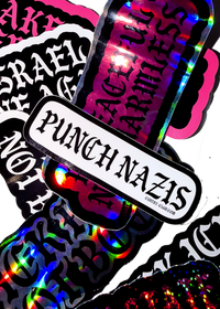 White "Punch Nazis" sticker with black gothic lettering on a pile of Cuntry Club stickers