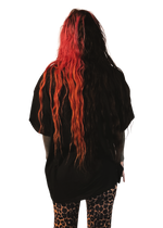 alternative femme with piercings, tattoos and split dye hair wearing a boxy oversized "ruin rapists' lives" tee from the back
