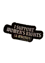 Silver holographic Boobs Not Bombs sticker with black gothic lettering