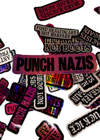Three XL Punch Nazis anti racism stickers in silver, pink and rose glitter with bold black lettering